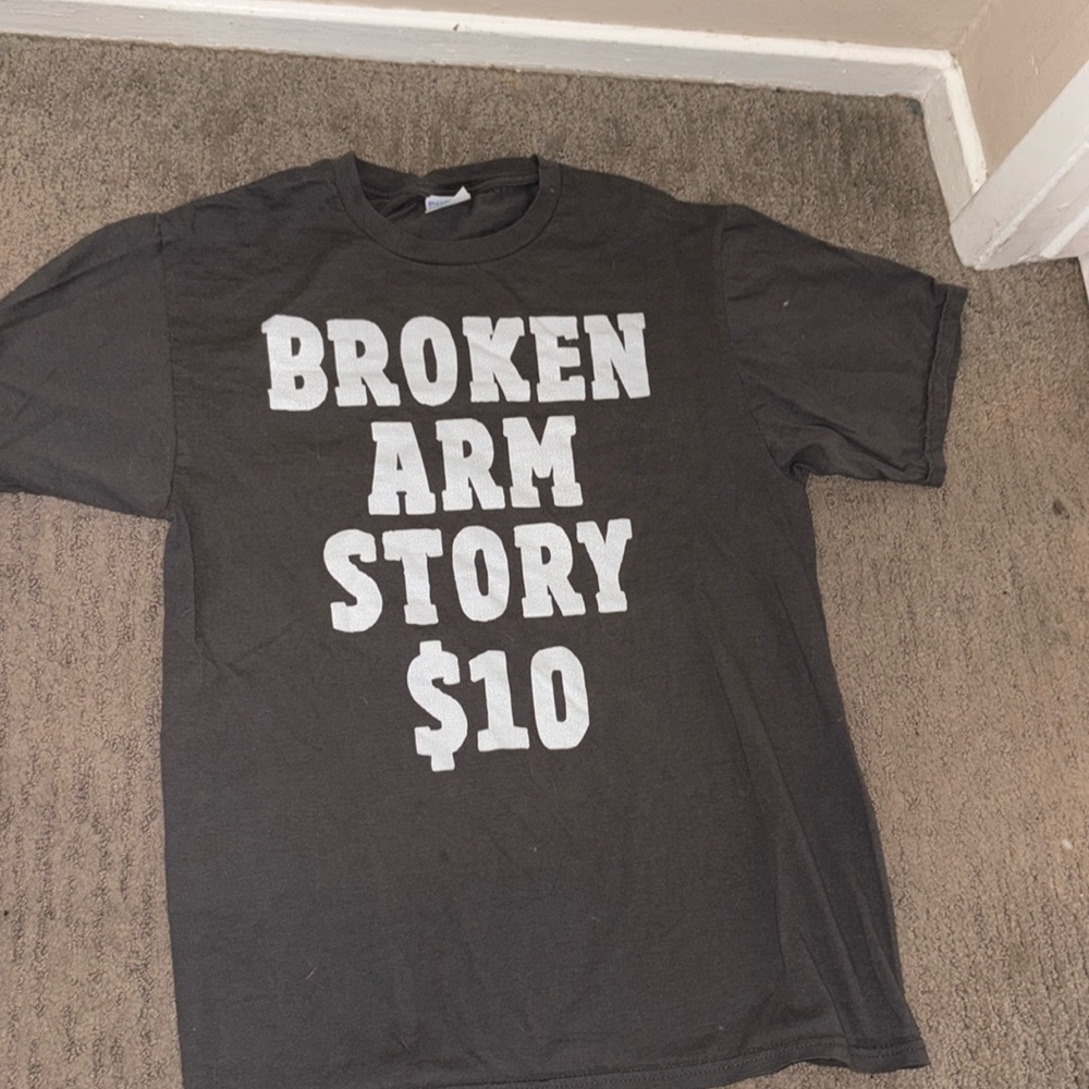 Grey “Broken Arm Story $10” tee shirt